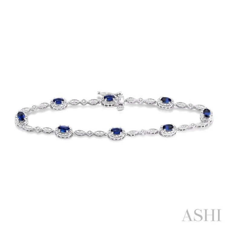 5x3 MM Oval Cut Sapphire and 1/20 Ctw Single Cut Diamond Bracelet in 10K White Gold