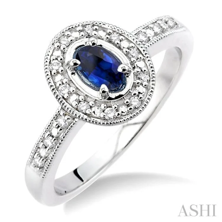 5x3mm oval cut Sapphire and 1/10 Ctw Single Cut Diamond Ring in 14K White Gold.